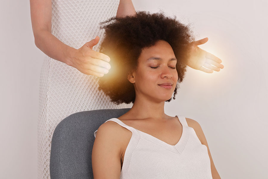 Reiki healer doing holistic treatment